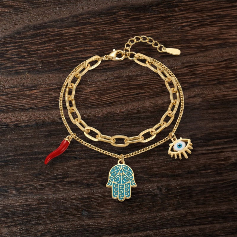 A gold bracelet made of rust-resistant stainless steel, with a design that combines blue palm, eye, and attractive red pepper charms, with an adjustable clasp to suit you. - Image 5